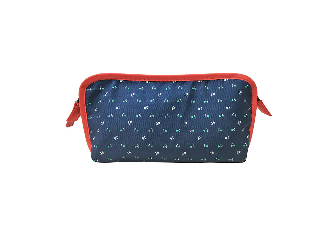 Floral print cosmetic bag in dark blue with red trimming