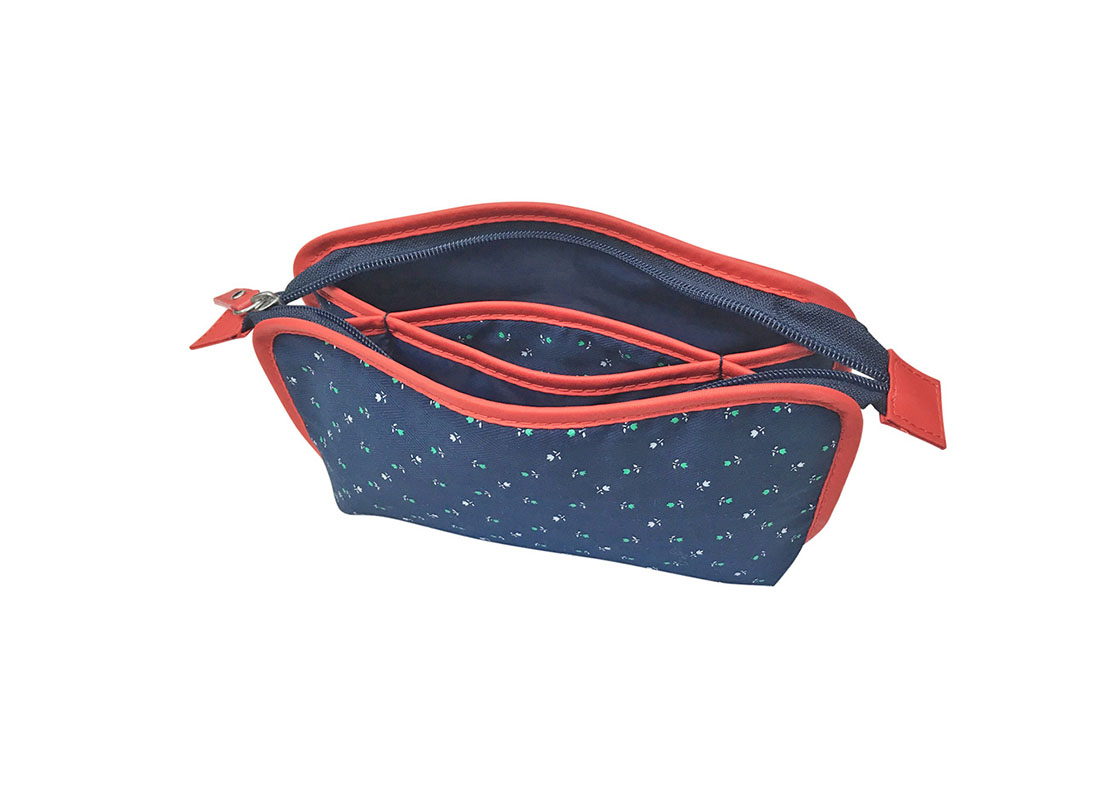 Open Floral cosmetic bag in dark blue with red trimming